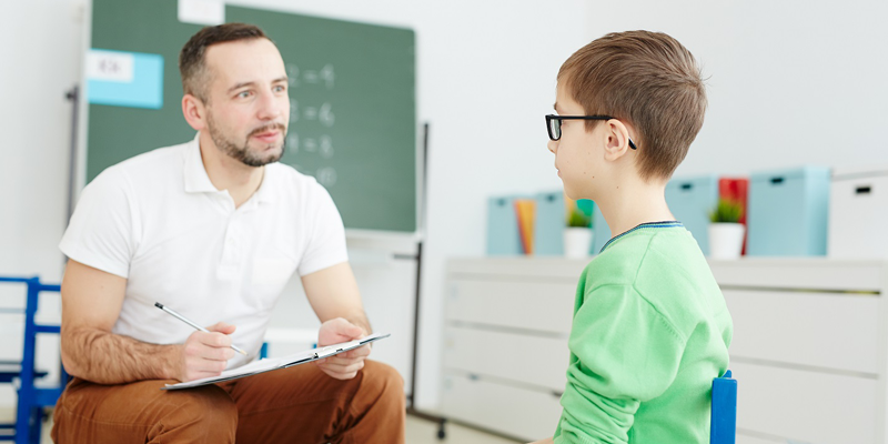 Young-child-with-tutor-during-tutoring-session-at-centre-in-Sussex