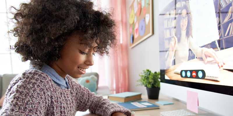 Young-girl-receiving-online-tuition-at-home